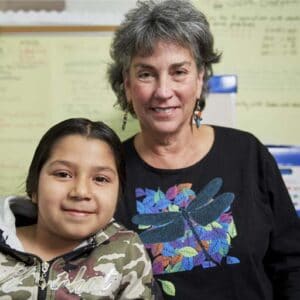 Succeeding by Reading Tutor Ann Rosenberg with student.