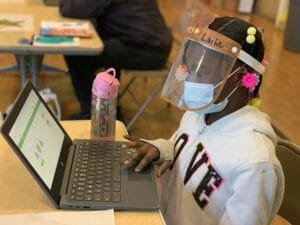 A student practices math at Sankofa United Elementary School.