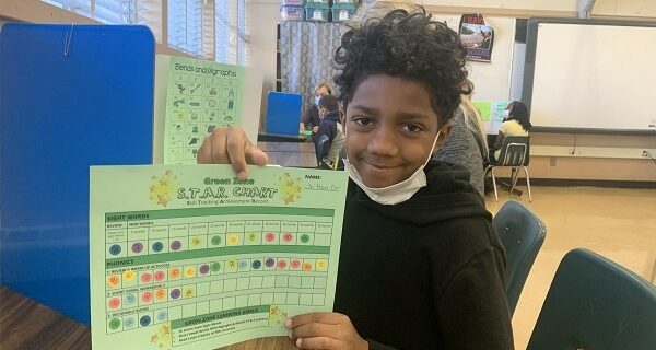 Thanks to his POWER Pack and tutor, Jamari has progressed two levels in reading.
