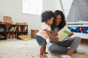 Black Mother Reading to Child