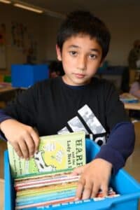 Latino boy with book - Hispanic Heritage Month 2023