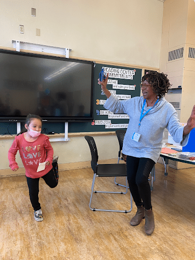 Miss Iyana and Bridget dancing.